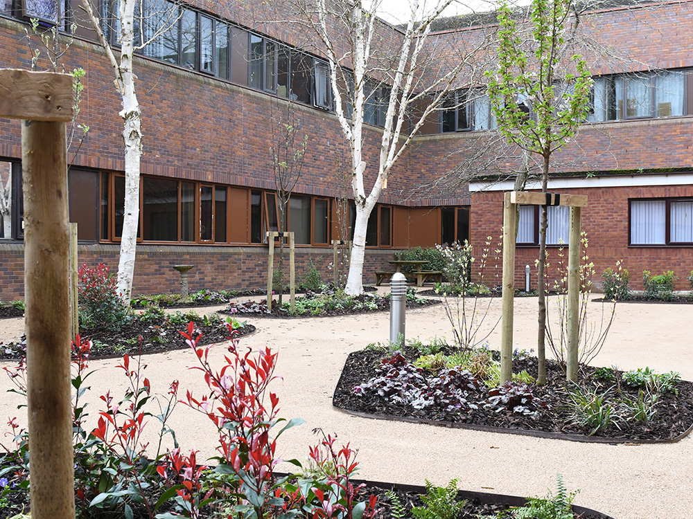 This NHS courtyard was in need of some TLC to revive it back to a hospitable state that can be enjoyed by all, which included a complete ripping out and relandscaping of the whole outdoor space.